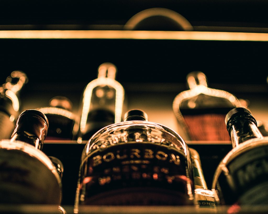 close up of bar bottles with light